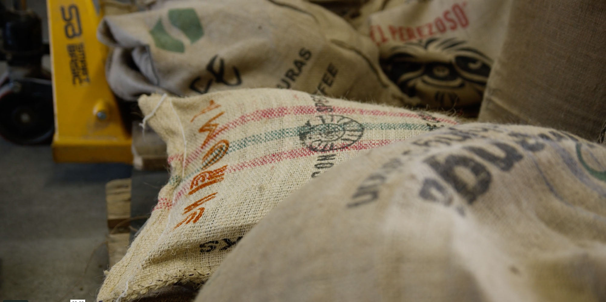 Coffee sacks in a warehouse setting
