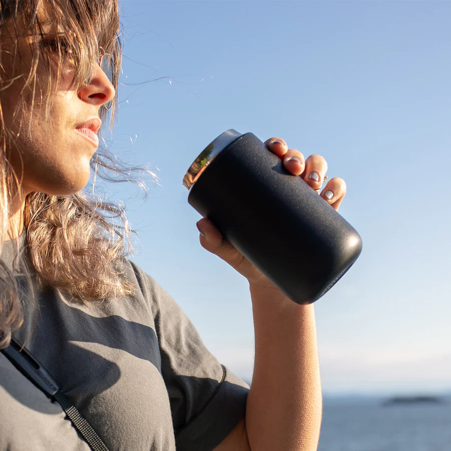 Woman drinking coffee from Fellow Carter Move