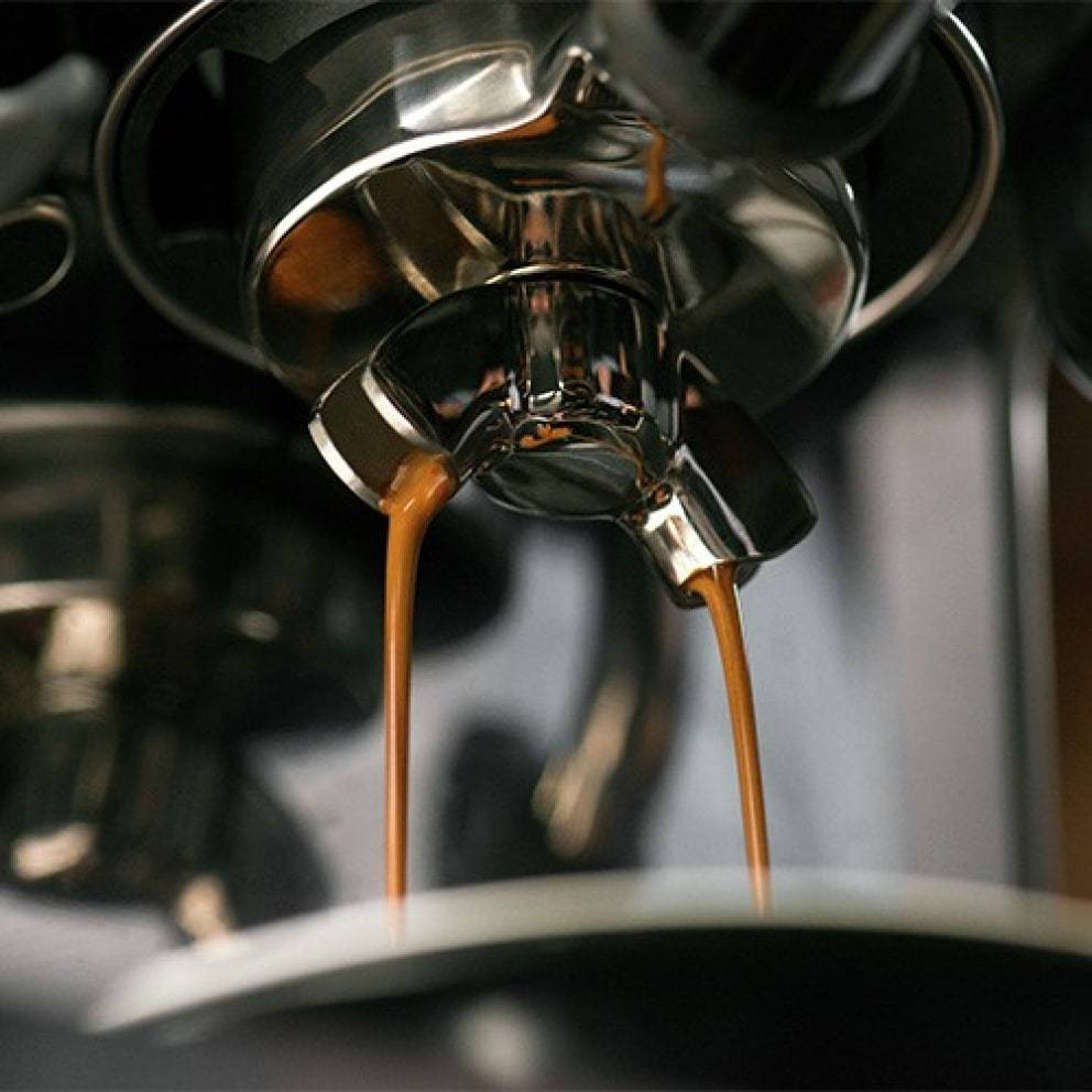Sage Barista Touch Black Truffle pouring espresso