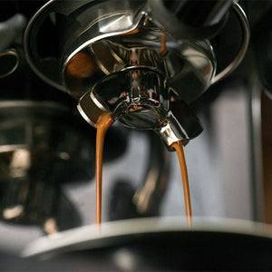 Sage Barista Touch Black Truffle pouring espresso