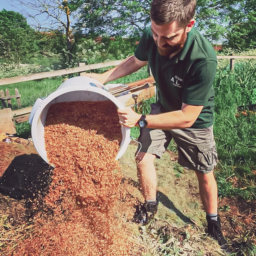 Emptying coffee waste at an organic farm