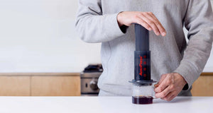 Man brewing coffee with Aeropress