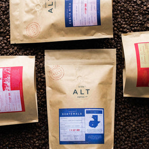four bags of specialty coffee beans