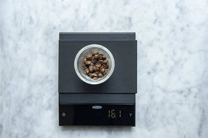 Felicita Incline weighing coffee beans